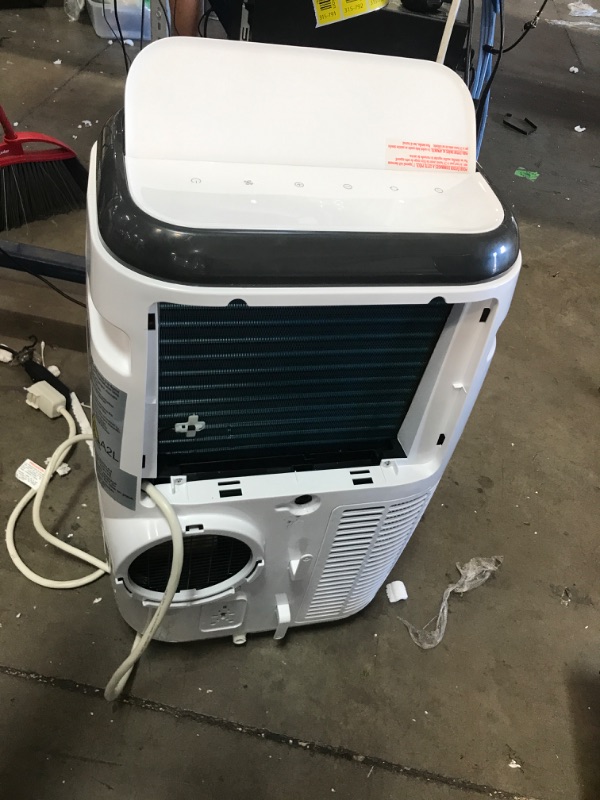 Photo 4 of POWERS ON BUT DOES NOT BLOW ANY AIR* NEEDS REPAIR* PARTS ONLY*
BLACK+DECKER 14,000 BTU Portable Air Conditioner with Remote Control, White
