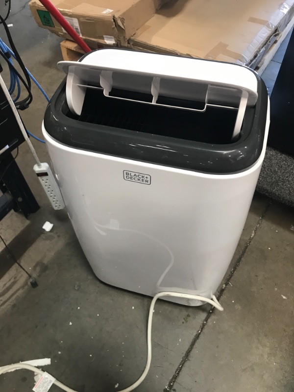 Photo 2 of POWERS ON BUT DOES NOT BLOW ANY AIR* NEEDS REPAIR* PARTS ONLY*
BLACK+DECKER 14,000 BTU Portable Air Conditioner with Remote Control, White
