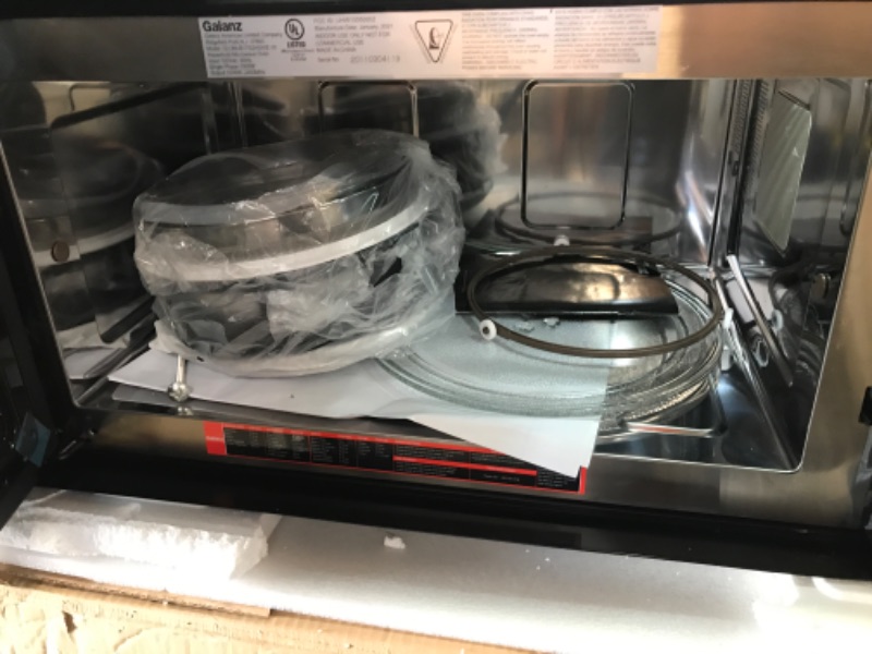 Photo 5 of damaged* powers on**
30 Inch Convection Over the Range Microwave Oven with 1.7 cu. ft. Capacity, Air Fry, Convertible Venting, 300 CFM, 10 Power Levels, True European Convection, Cooktop LED Lighting