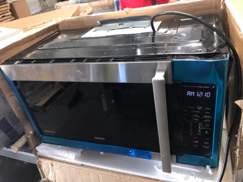 Photo 3 of damaged* powers on**
30 Inch Convection Over the Range Microwave Oven with 1.7 cu. ft. Capacity, Air Fry, Convertible Venting, 300 CFM, 10 Power Levels, True European Convection, Cooktop LED Lighting