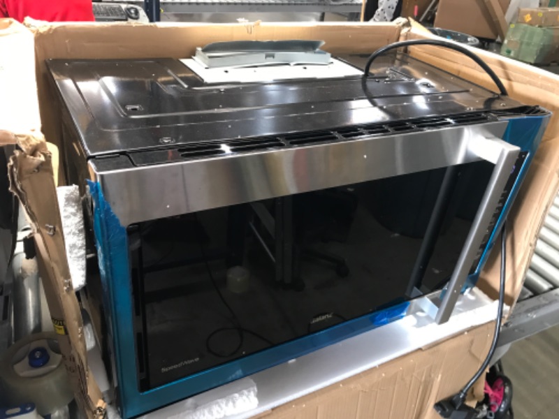 Photo 4 of damaged* powers on**
30 Inch Convection Over the Range Microwave Oven with 1.7 cu. ft. Capacity, Air Fry, Convertible Venting, 300 CFM, 10 Power Levels, True European Convection, Cooktop LED Lighting