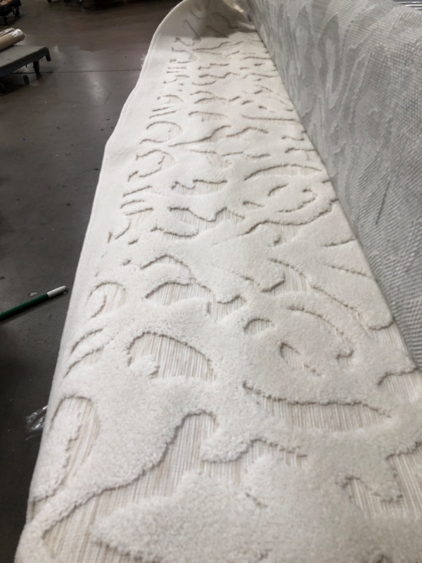 Photo 1 of 8X0 WHITE PATTERENED AREA RUG