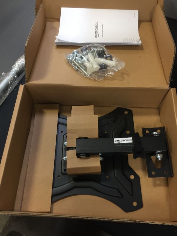 Photo 1 of Amazon Basics Single Arm Swivel and Tilt TV Wall Mount, fits TVs 23-50" up to 44lbs