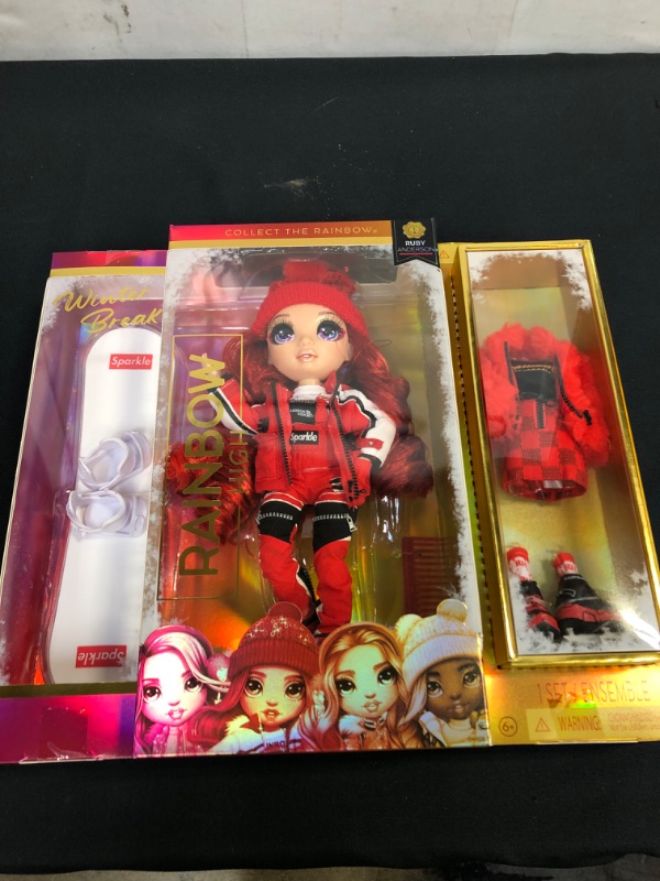 Photo 2 of Rainbow High Winter Break Ruby Anderson - Red Fashion Doll Playset with 2 Complete Doll Outfits Snowboard and Winter Accessories Great Toy Gift