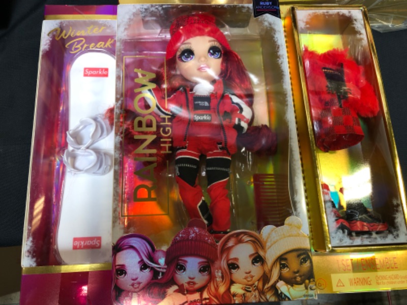 Photo 2 of Rainbow High Winter Break Ruby Anderson - Red Fashion Doll Playset with 2 Complete Doll Outfits Snowboard and Winter Accessories Great Toy Gift