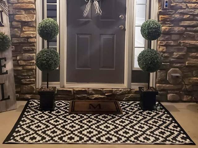 Photo 1 of Black and White Reversible Indoor/Outdoor Rug That's UV and Stain Resistant. Ideal Outdoor Carpet and Patio Rug at 6 ft x 3.9 ft (180 cm x 120 cm). Looks Great in Gardens, Decks and on Balconies.