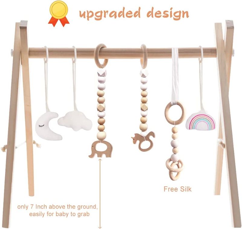 Photo 1 of Baby Play Gym Wooden Baby Gym with 6 Toys Foldable Play Gym Frame Activity Gym Hanging Bar Baby Toy White
