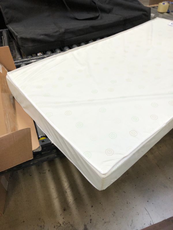 Photo 2 of Delta Children Twinkle Galaxy Dual Sided Crib and Toddler Mattress - Premium Sustainably Sourced Fiber Core - Waterproof - GREENGUARD Gold Certified (Non-Toxic) - 7 Year Warranty - Made in USA----------------THE PLASTIC FILM HAS BEEN TAKEN OFF ---------
