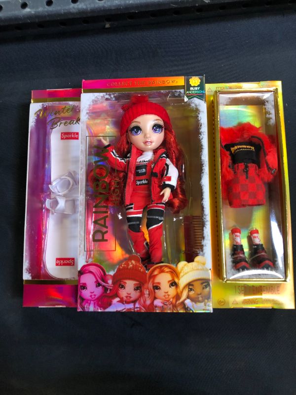 Photo 2 of Rainbow High Winter Break Ruby Anderson – Red Fashion Doll and Playset with 2 Designer Outfits, Snowboard and Accessories
