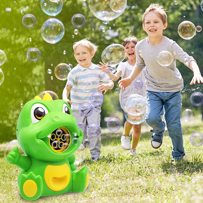 Photo 1 of Bubble Machine with Bubble Solution, Dinosaur Party Supply, Non-Toxic Automatic Bubble Blower for Toddlers, Indoor and Outdoor Toy for Kids