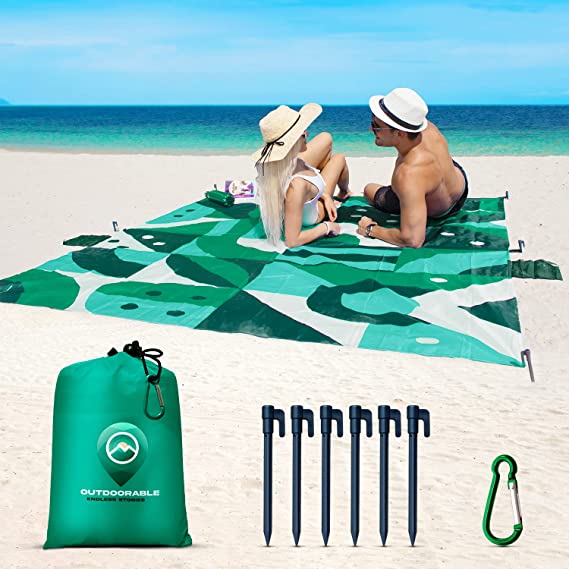 Photo 1 of Beach Blanket Sandproof Waterproof - Italian Design - Beach Mat Sand Free Waterproof 79" x 83" with 6 Stakes and Zippered Pockets - Sand Free Beach Blankets for Camping, Picnic, Hiking and Festivals