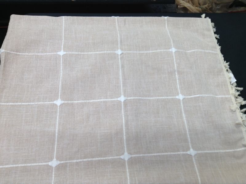 Photo 1 of  THROW BLANKET WITH NATURAL WITH WHITE EMBROIDERD SQUARE DESIGNS 