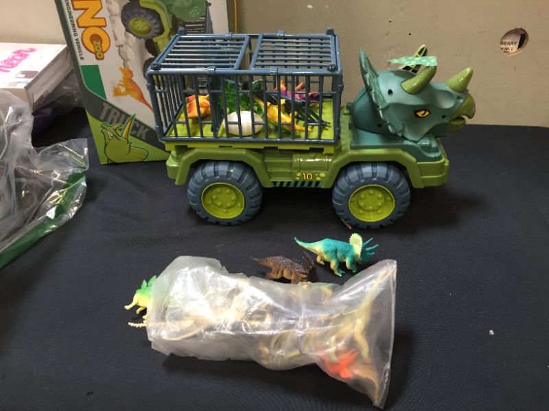 Photo 4 of Dinosaur Transport Truck Car with Dinosaur Toys for Kids 3-5 Boys Girls Birthday Gift Truck Toys Car with 15 Dino Figures Egg and Tree
