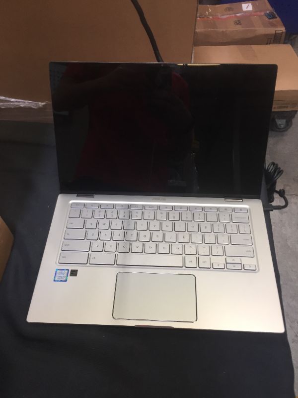 Photo 1 of ASUS Chromebook Flip C434 2-In-1 Laptop, 14" Full HD Touchscreen 4-Way NanoEdge, Intel Core M3-8100Y Processor, 4GB RAM, 64GB eMMC Storage, All-Metal Body, Backlit KB, Chrome OS- C434TA-DSM4T, Silver
parts only - didn't turn on 