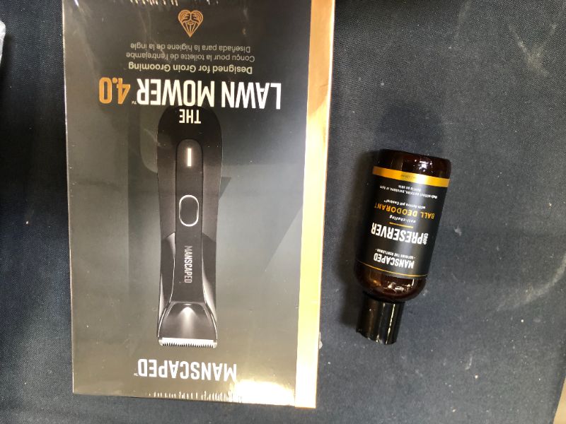 Photo 2 of MANSCAPED™ Nuts and Bolts 4.0, Men's Grooming Kit, Includes The Lawn Mower™ 4.0 Ergonomically Designed Powerful Waterproof Trimmer, The Crop Preserver™ Ball Deodorant and Disposable Shaving Mats
