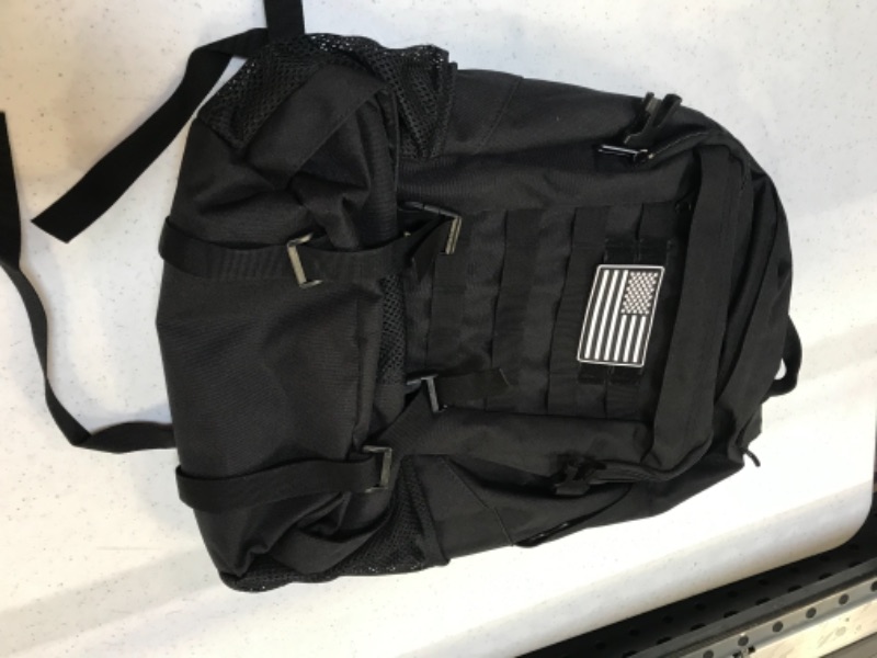 Photo 3 of black backpack with compartments 
