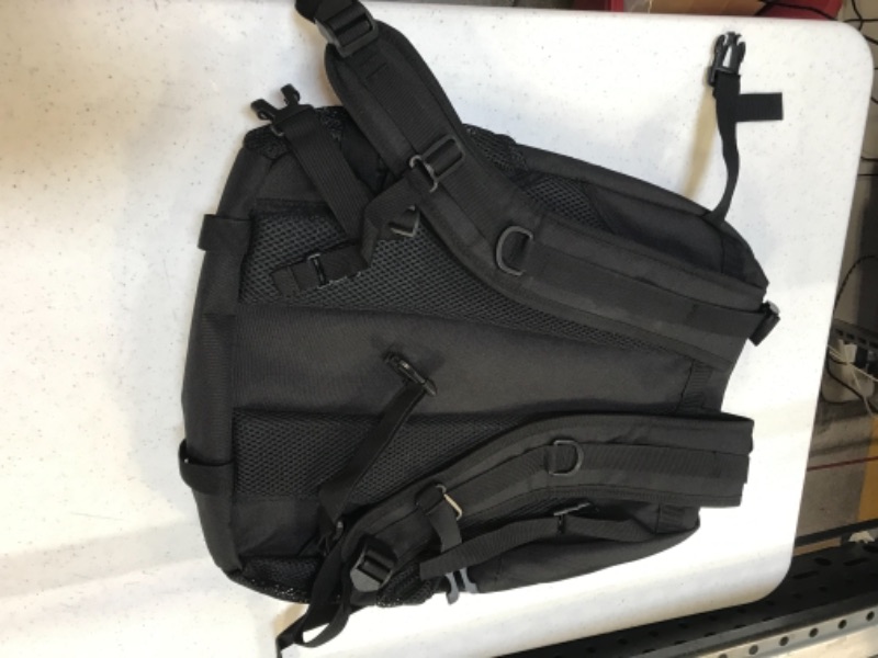 Photo 2 of black backpack with compartments 
