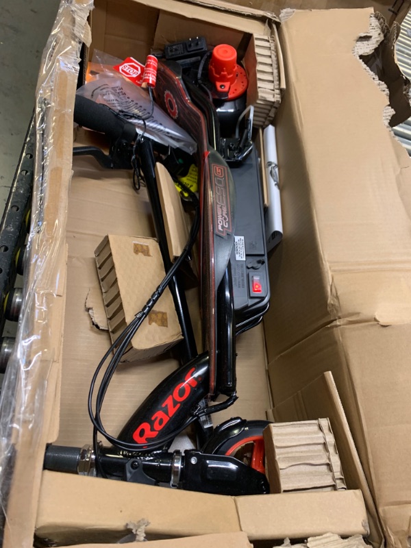 Photo 3 of Razor Power Core E90 Electric Scooter, Box Packaging Badly Damaged, Moderate Use, Scratches and Scuffs on item, Scooter Turns on. 