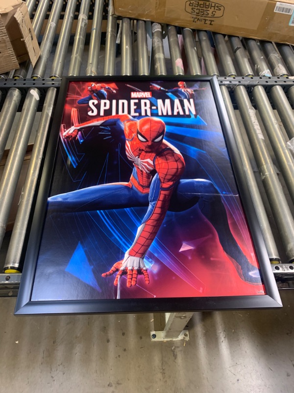 Photo 1 of 2'x'3 SpiderMan Poster With Frame, Box Packaging Damaged, Moderate Use, Scratches and Scuffs on item, Crease in Picture
