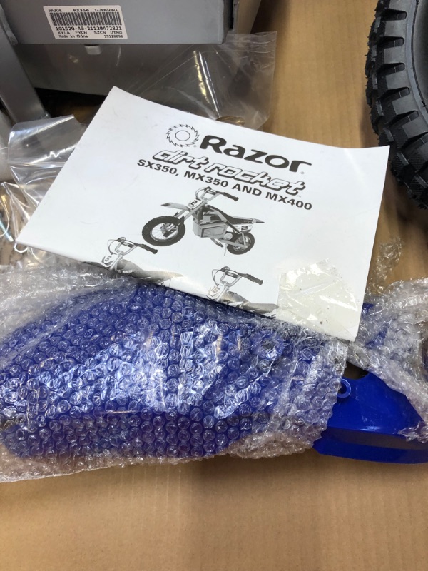 Photo 5 of *****MAJOR DAMAGE TO PACKAGING****Razor MX350 Dirt Rocket Electric Motocross Bike - Blue