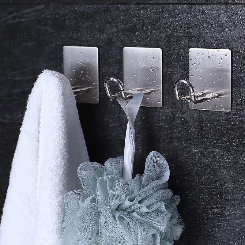 Photo 2 of Adhesive Towel Hooks for Bathroom, 8Pcs Stainless Steel Over The Door Hooks for Hanging, Heavy Duty Wall Mounted Towel Hanger Rack Robe Hook Bathroom Organizer for Towels Robe Coat Shirt Hat
