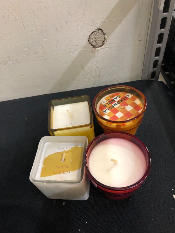 Photo 1 of 
miscellaneous scented candle 4 pack (minor damage to packaging)