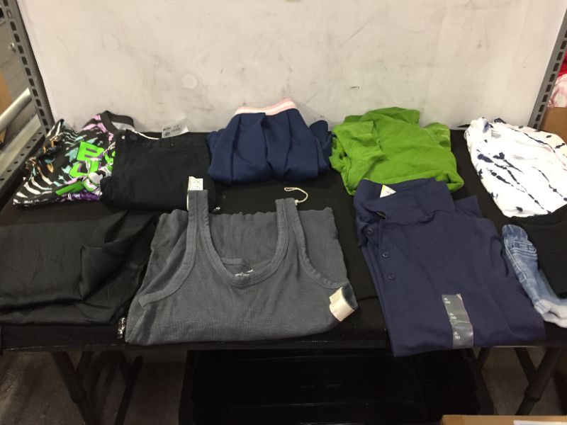 Photo 1 of BAG LOT OF CLOTHING BOYS, GIRLS, AND WOMEN DIFFERENT SIZES ---SOLD AS IS ---