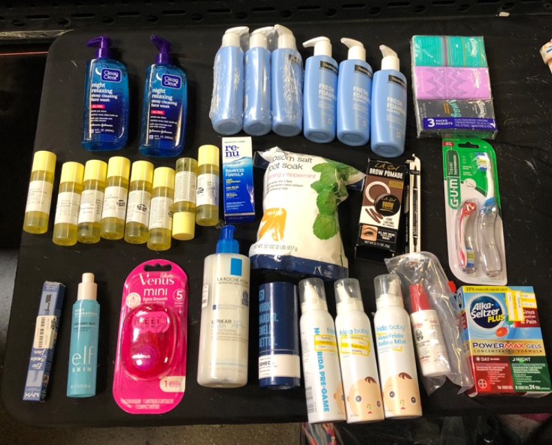Photo 1 of Bag Lot - Daily Brightening Solution 8 Bottles , Night Relaxing Face Wash Clean and Clear 2 Bottles , 6 Bottles of  Fresh Foaming Cleanser Neutrogena , Epson Salt Foot Soak Peppermint, Moisturizing Wash , Cologne , Eye Liner , Tooth Brushes ,Alka-Seltzer 