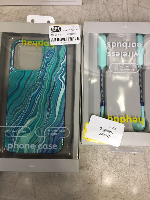 Photo 1 of PHONE CASE 13 PRO AND WIRELESS EARBUDS BUNDLE --SOLD AS IS --