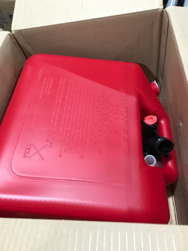 Photo 2 of GARAGE BOSS GB351 Briggs and Stratton Press 'N Pour Gas Can, 5 gallon, Red Plastic