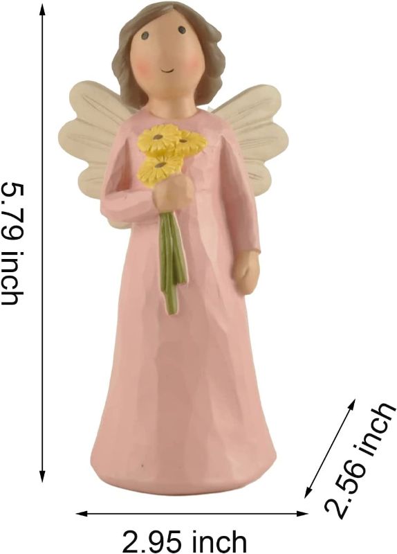 Photo 1 of Angel Statue Holding Sunflower Birthday Party Decorations, 5.79" Tall, Pink