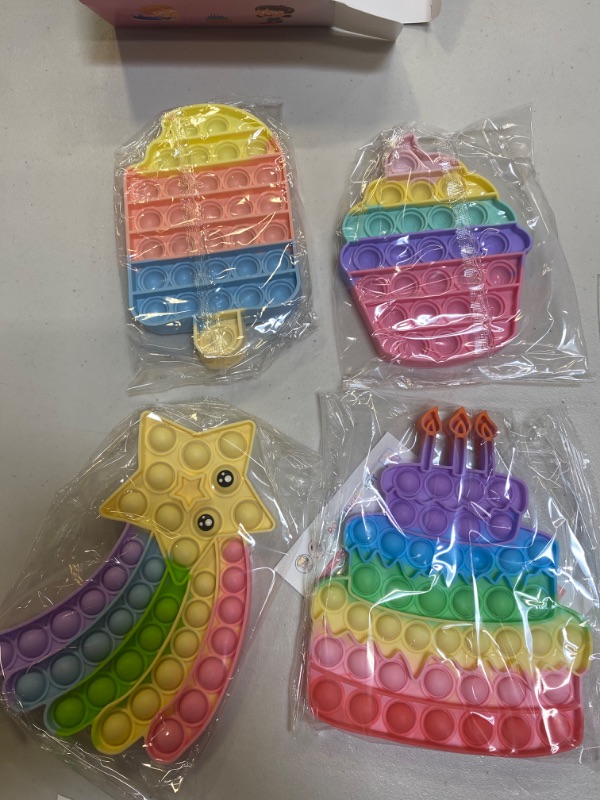Photo 1 of Abesee 4 Pack Pop Fidget Toys, Its Poppers Bubble with Pop Sound Sensory Fidget Toy, Cake Popsicle Ice Cream Star for Kids and Adults Stress Relief, ADHD Autism Silicone Pressure Relieving Toys

