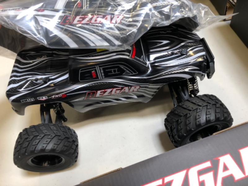 Photo 7 of BEZGAR HM121 1:12 Scale RC Truck - 4x4 Offroad Waterproof High Speed 45+ KM/H Remote Control Truck for All Terrains, 2.4Ghz 4WD Fast RC Cars for Adults and Kids Boys with 2 Rechargebale Batteries
