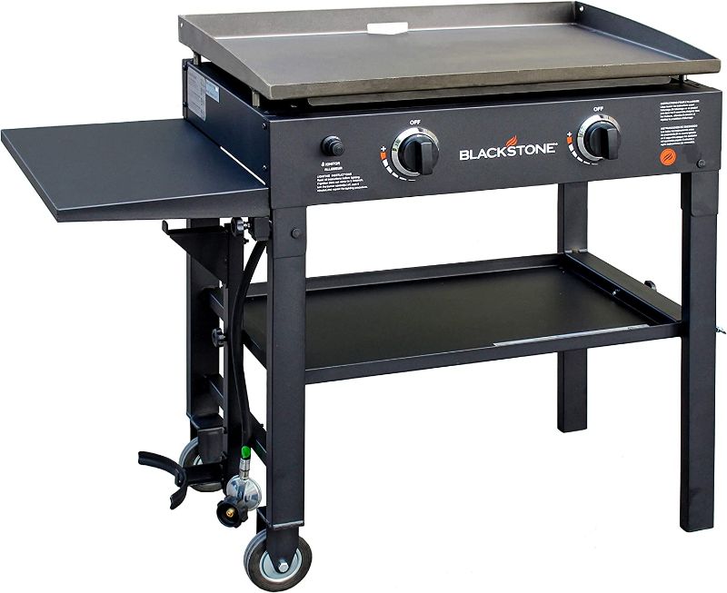 Photo 1 of Blackstone Flat Top Gas Grill Griddle 2 Burner Propane Fuelled Rear Grease Management System, 1517, Outdoor Griddle Station for Camping with Built in Cutting Board and Garbage Holder, 28 inch

