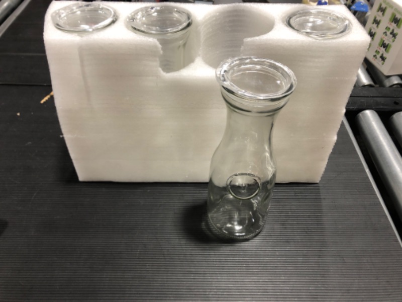 Photo 1 of 4 Glass bottles with a wide opening and lid