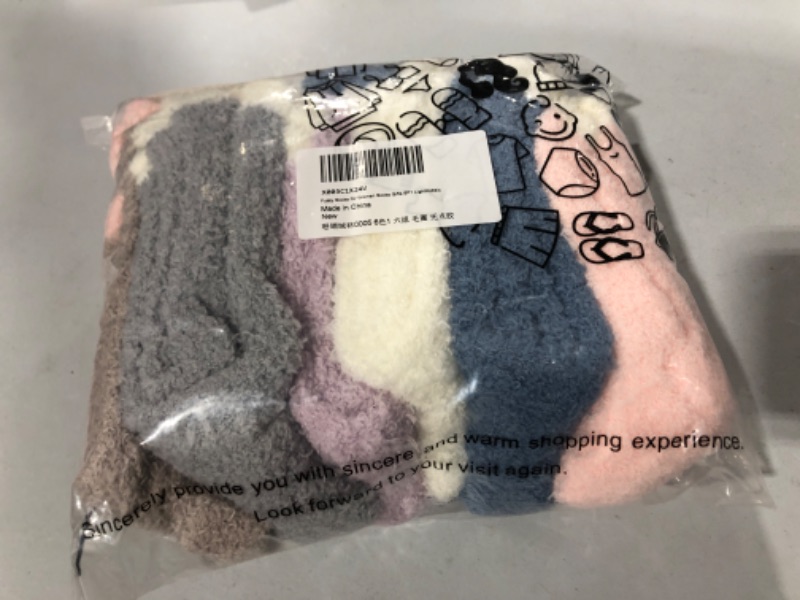 Photo 1 of 6 pairs of Women's Fuzzy Socks. unknown size