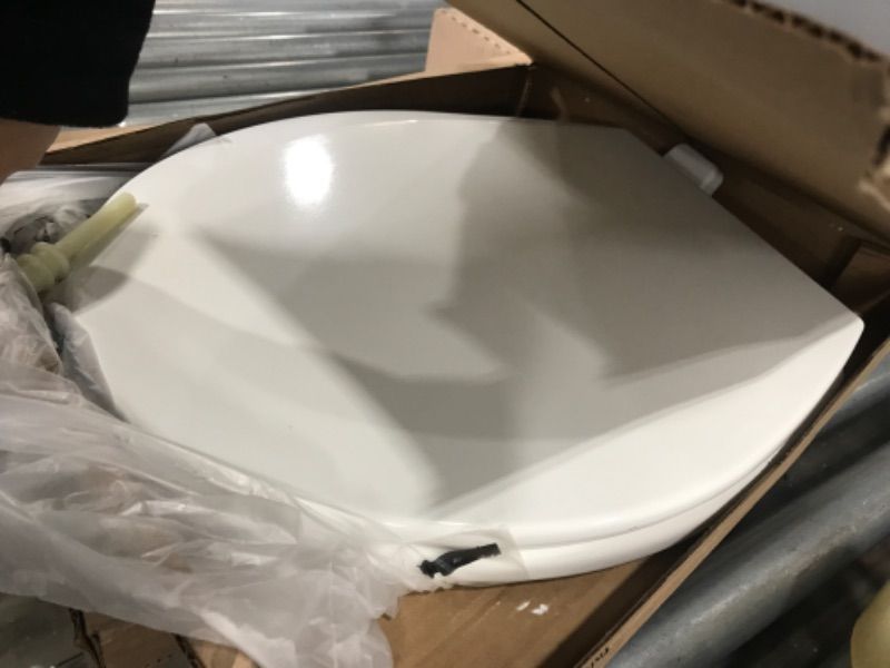 Photo 2 of BEMIS Adjustable Round Closed Front Enameled Wood Toilet Seat in White