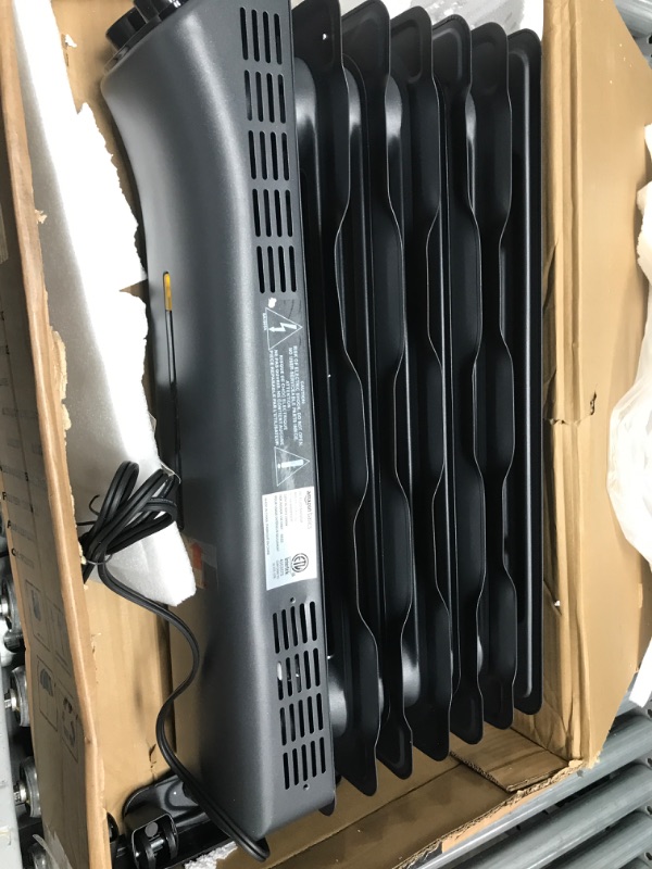 Photo 3 of Amazon Basics Portable Radiator Heater with 7 Wavy Fins, Manual Control, Black, 1500W
