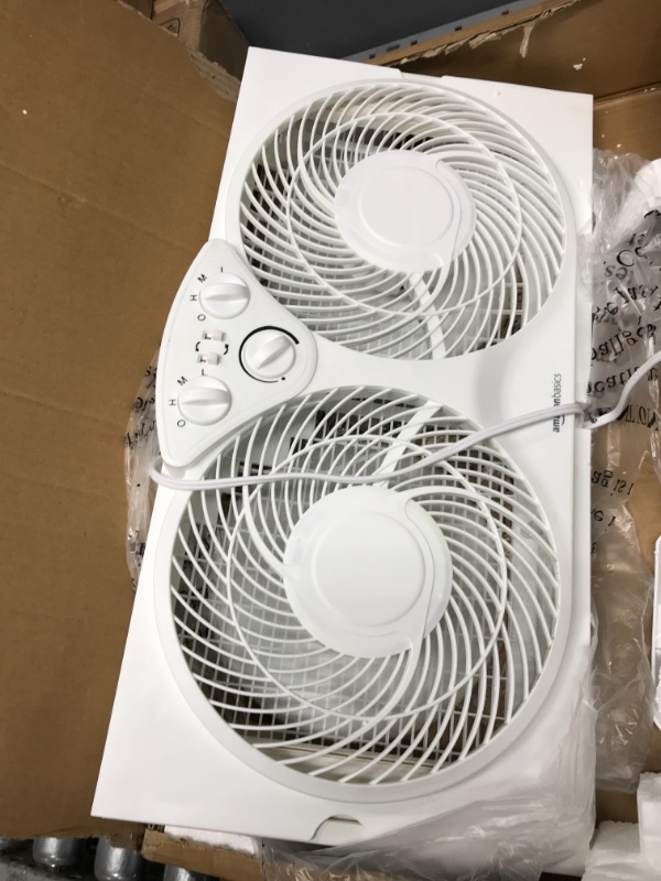 Photo 4 of Amazon Basics Window Fan with Manual Controls, Twin 9-Inch Reversible Airflow Blades