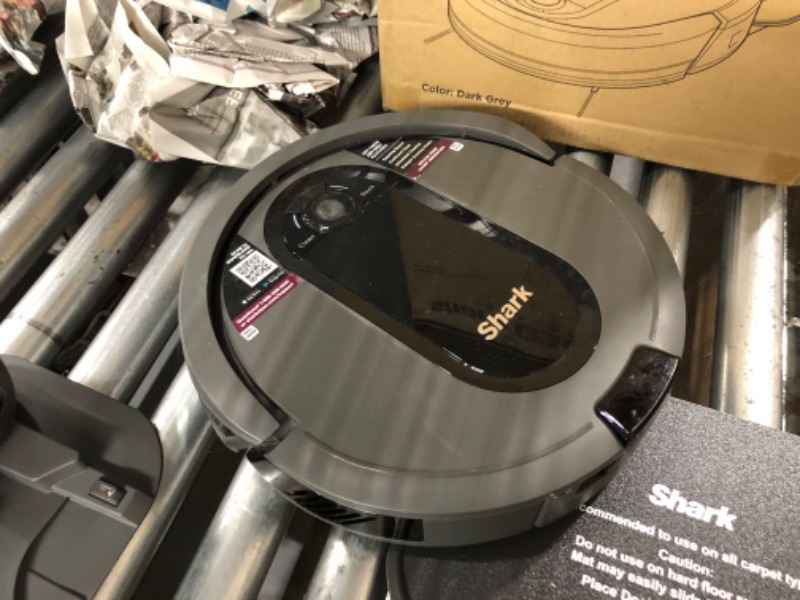 Photo 2 of **used**
Shark AV911S EZ Robot Vacuum with Self-Empty Base, Bagless, Row-by-Row Cleaning, Perfect for Pet Hair, Compatible with Alexa, Wi-Fi, Gray Multi-Surface Brushroll Gray 30 Day Self-Empty Base Capacity