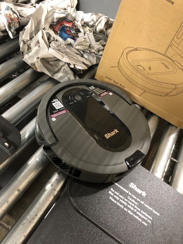 Photo 3 of **used**
Shark AV911S EZ Robot Vacuum with Self-Empty Base, Bagless, Row-by-Row Cleaning, Perfect for Pet Hair, Compatible with Alexa, Wi-Fi, Gray Multi-Surface Brushroll Gray 30 Day Self-Empty Base Capacity