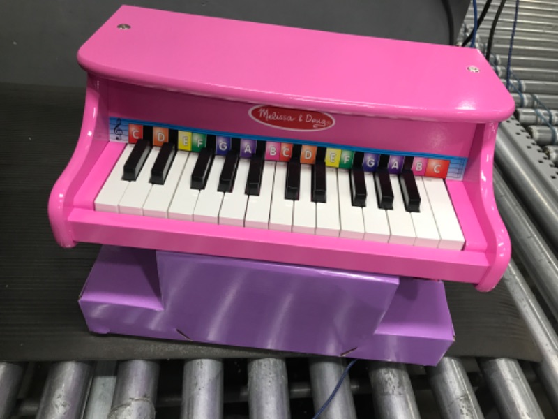 Photo 2 of Melissa & Doug Learn-to-Play Pink Piano With 25 Keys and Color-Coded Songbook