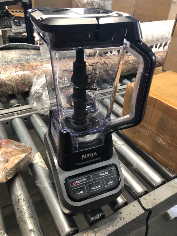 Photo 3 of CRACKED HANDLE**Ninja BL610 Professional 72 Oz Countertop Blender with 1000-Watt Base and Total Crushing Technology for Smoothies, Ice and Frozen Fruit, Black, 9.5 in L x 7.5 in W x 17 in H