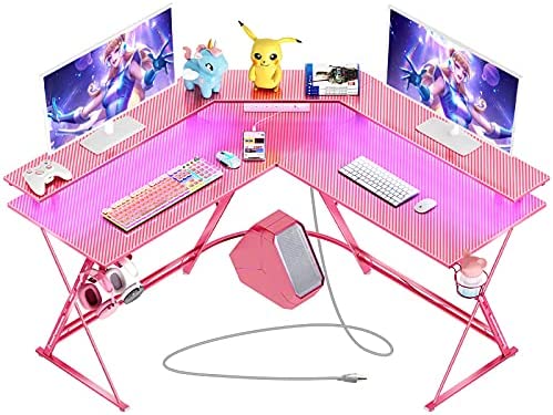 Photo 1 of DAMAGED DESK CORNER***SEVEN WARRIOR Gaming Desk 50.4” with LED Strip & Power Outlets, L-Shaped Computer Corner Desk Carbon Fiber Surface with Monitor Stand, Ergonomic Gamer Table with Cup Holder, Headphone Hook, Pink
