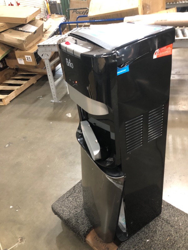 Photo 2 of ***PARTS ONLY*** DAMAGED Brio Bottom Loading Water Cooler Water Dispenser – Essential Series - 3 Temperature Settings - Hot, Cold & Cool Water - UL/Energy Star Approved
**DENTS, CRUSHED, BROKEN ON TOP, BOTTOM DOOR BROKEN, POWERED ON**
