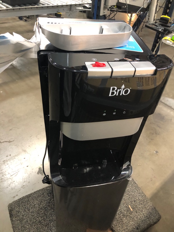 Photo 3 of ***PARTS ONLY*** DAMAGED Brio Bottom Loading Water Cooler Water Dispenser – Essential Series - 3 Temperature Settings - Hot, Cold & Cool Water - UL/Energy Star Approved
**DENTS, CRUSHED, BROKEN ON TOP, BOTTOM DOOR BROKEN, POWERED ON**
