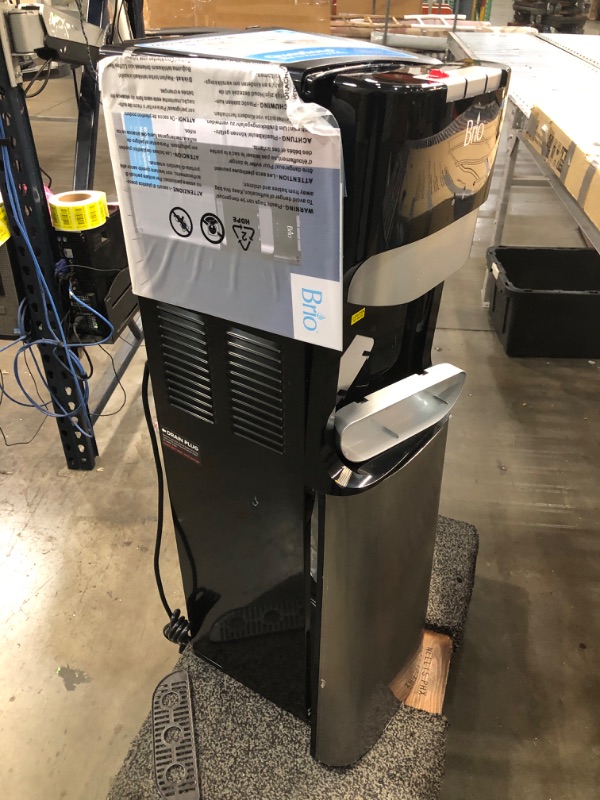 Photo 7 of ***PARTS ONLY*** DAMAGED Brio Bottom Loading Water Cooler Water Dispenser – Essential Series - 3 Temperature Settings - Hot, Cold & Cool Water - UL/Energy Star Approved
**DENTS, CRUSHED, BROKEN ON TOP, BOTTOM DOOR BROKEN, POWERED ON**
