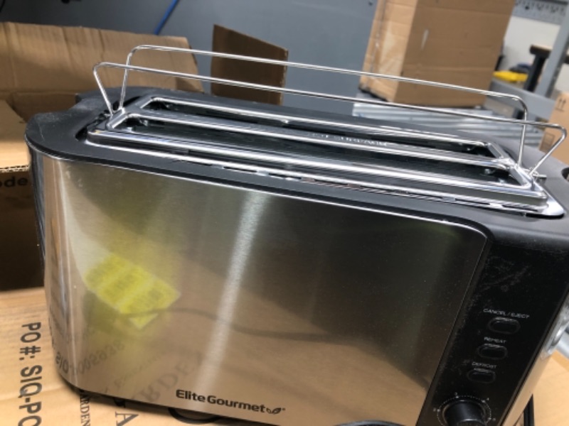 Photo 2 of ***PARTS ONLY, NON-FUNCTIONAL***
Elite Gourmet ECT-3100# Long Slot 4 Slice Toaster, Reheat, 6 Toast Settings, Defrost, Cancel Functions, Built-in Warming Rack, Extra Wide Slots for Bagels Waffles, Stainless Steel & Black
