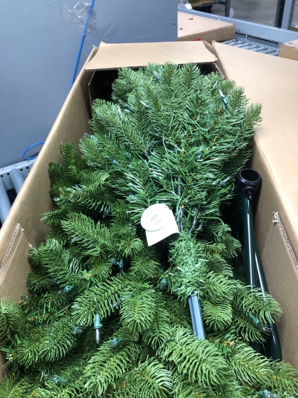 Photo 2 of *** TESTED*** National Tree Company Pre-Lit 'Feel Real' Artificial Full Downswept Christmas Tree, Green, Douglas Fir, White Lights, Includes Stand, 6.5 feet 6.5 ft