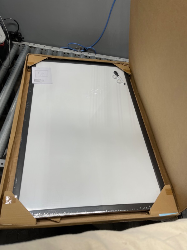 Photo 2 of Amazon Basics Magnetic Dry Erase White Board, 35 x 23-Inch Whiteboard - Black Wooden Frame
